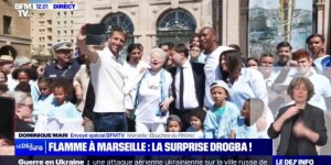 【龙八国际】法媒：德罗巴在马赛参加奥运圣火传递，与民众合影