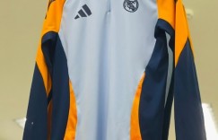 【龙八国际】皇马24-25赛季客场球衣曝光：亮橙色搭配黑色，衣领有白色条纹